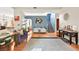 Open concept living space featuring hardwood floors, staircase, and modern decor at 262 Cielito Lindo St, Henderson, NV 89012