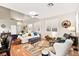 Well-lit living space with vaulted ceiling, hardwood floors, and modern furniture at 262 Cielito Lindo St, Henderson, NV 89012