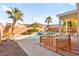 Beautiful backyard with a sparkling pool, covered patio, and cozy outdoor seating at 262 Cielito Lindo St, Henderson, NV 89012