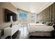 Beautiful bedroom featuring a padded headboard and expansive views of the city skyline at 2747 Paradise Rd # 2606, Las Vegas, NV 89109