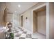 Elegant hallway featuring marble floors, decorative wallpaper, and convenient elevator access at 2747 Paradise Rd # 2606, Las Vegas, NV 89109