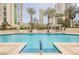 Relaxing swimming pool surrounded by lounge chairs and lush landscaping at 2747 Paradise Rd # 2606, Las Vegas, NV 89109