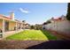 Spacious backyard with a covered patio and lush green lawn, perfect for relaxing and enjoying outdoor activities at 2905 Gentilly Ln, Las Vegas, NV 89108