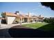 Backyard featuring a covered patio, a grill, and a well-kept lawn, great for outdoor living and dining at 2905 Gentilly Ln, Las Vegas, NV 89108