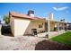 Backyard showcasing a covered patio, a barbecue grill, and a green lawn, creating an outdoor oasis at 2905 Gentilly Ln, Las Vegas, NV 89108