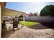 A covered patio and grill area in a landscaped backyard, ideal for entertaining and outdoor enjoyment at 2905 Gentilly Ln, Las Vegas, NV 89108