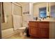 Clean bathroom with tiled shower, toilet, vanity, cabinets, and lighting at 2905 Gentilly Ln, Las Vegas, NV 89108