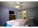 Inviting bedroom with ceiling fan, closet, and a private ensuite bathroom at 2905 Gentilly Ln, Las Vegas, NV 89108
