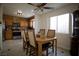Cozy dining area featuring a ceiling fan, natural light, and a view to the kitchen at 2905 Gentilly Ln, Las Vegas, NV 89108