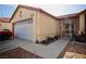 Exterior view showing the home's facade, garage, walkway, and gate-enclosed front yard at 2905 Gentilly Ln, Las Vegas, NV 89108