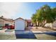 Exterior view of the house, showing front yard landscaping and gated entrance at 2905 Gentilly Ln, Las Vegas, NV 89108