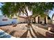 Charming single-story home featuring well-maintained landscaping, decorative rocks, and a mature shade tree at 2905 Gentilly Ln, Las Vegas, NV 89108