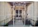 Close-up of the gated and covered front porch, adding security and curb appeal to the property at 2905 Gentilly Ln, Las Vegas, NV 89108