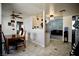 View from kitchen to living room and dining area, featuring tile floors and natural light at 2905 Gentilly Ln, Las Vegas, NV 89108