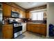 Well-lit kitchen with stainless steel appliances and a tiled backsplash for a modern touch at 2905 Gentilly Ln, Las Vegas, NV 89108
