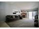 Spacious living room features a fireplace, plush seating, and sliding glass doors to the outside at 2905 Gentilly Ln, Las Vegas, NV 89108