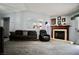 Comfortable living room offering carpeted floors, natural light, and a view of the fireplace at 2905 Gentilly Ln, Las Vegas, NV 89108