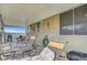 The covered back patio includes lounge chairs, a grill, and stone flooring at 291 Lido Dr, Henderson, NV 89015