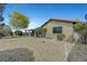 Low-maintenance backyard with drought-resistant landscaping and a covered patio at 291 Lido Dr, Henderson, NV 89015
