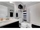Bathroom featuring single sink with gray cabinet, shower and a striped shower curtain at 291 Lido Dr, Henderson, NV 89015