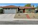 Charming home featuring a red tile roof, desert landscaping, brick walkway and an attached two-car garage at 291 Lido Dr, Henderson, NV 89015