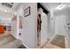 Hallway featuring tile and carpeted floor, with a closet and access to other rooms at 291 Lido Dr, Henderson, NV 89015