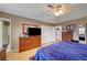 Comfortable main bedroom with ceiling fan, a large dresser and closet doors at 291 Lido Dr, Henderson, NV 89015