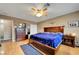 Well-lit main bedroom featuring a wooden bed, ceiling fan, and coordinating furniture at 291 Lido Dr, Henderson, NV 89015
