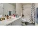Bathroom with a shower-tub combo and ample counter space at 3561 Cherbourg Ave, Las Vegas, NV 89141