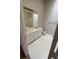 Bright bathroom featuring double sinks, ample counter space, and a large mirror at 3561 Cherbourg Ave, Las Vegas, NV 89141