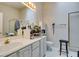 Bright bathroom with double sinks and a walk-in shower at 3561 Cherbourg Ave, Las Vegas, NV 89141