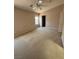 Bedroom with neutral carpet, natural light, and ceiling fan at 3561 Cherbourg Ave, Las Vegas, NV 89141