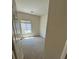 This bedroom has carpet, a window with a view and an open door at 3561 Cherbourg Ave, Las Vegas, NV 89141