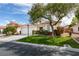 Charming single-story home with a well-maintained lawn, mature tree, and a two-car garage at 3561 Cherbourg Ave, Las Vegas, NV 89141