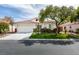 Charming single-story home with a well-maintained lawn, mature tree, and a two-car garage at 3561 Cherbourg Ave, Las Vegas, NV 89141
