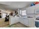 Open kitchen with white appliances overlooking the living space, great for entertaining at 3561 Cherbourg Ave, Las Vegas, NV 89141