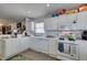Traditional kitchen with white cabinets, tile countertops and modern appliances at 3561 Cherbourg Ave, Las Vegas, NV 89141