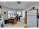 Bright kitchen area with a breakfast table, ample cabinets, and white appliances at 3561 Cherbourg Ave, Las Vegas, NV 89141