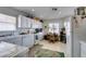 Functional kitchen featuring white appliances, tile countertops, and ample cabinet space at 3561 Cherbourg Ave, Las Vegas, NV 89141