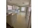 Bright kitchen with white appliances and tile flooring at 3561 Cherbourg Ave, Las Vegas, NV 89141