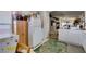 Open kitchen with white appliances overlooking the living space, great for entertaining at 3561 Cherbourg Ave, Las Vegas, NV 89141