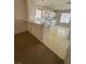 Spacious living room and kitchen area with bar seating at 3561 Cherbourg Ave, Las Vegas, NV 89141