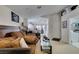 Spacious living room showcasing large sofa, access to the laundry room, and comfortable seating at 3561 Cherbourg Ave, Las Vegas, NV 89141