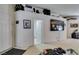View of living room showing access to entryway, doors, and large-screen TV at 3561 Cherbourg Ave, Las Vegas, NV 89141