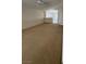 Open living room area with kitchen view at 3561 Cherbourg Ave, Las Vegas, NV 89141