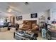 Spacious living room with vaulted ceilings, ceiling fan, and comfortable seating at 3561 Cherbourg Ave, Las Vegas, NV 89141