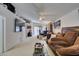 Spacious living room with vaulted ceilings, ceiling fan, and comfortable seating at 3561 Cherbourg Ave, Las Vegas, NV 89141