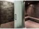Modern bathroom featuring a tiled walk-in shower and a built-in sauna with seating at 3726 Las Vegas Blvd # 2504, Las Vegas, NV 89158