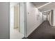 Modern hallway with carpet, ambient lighting, and access to rooms, ideal for a minimalist lifestyle at 3726 Las Vegas Blvd # 2504, Las Vegas, NV 89158
