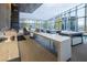 Spacious outdoor kitchen with bar seating and modern finishes, adjacent to a pool area and city views at 3726 Las Vegas Blvd # 2504, Las Vegas, NV 89158